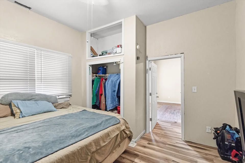 Bedroom with closet and window from the 300 Ripley listing photos