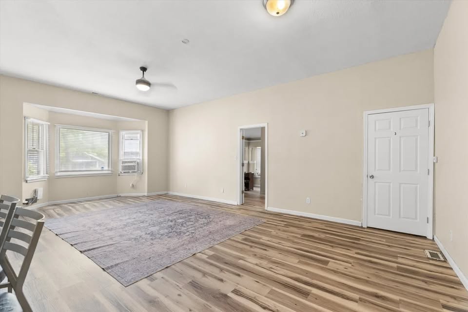 Living room with front window and rug