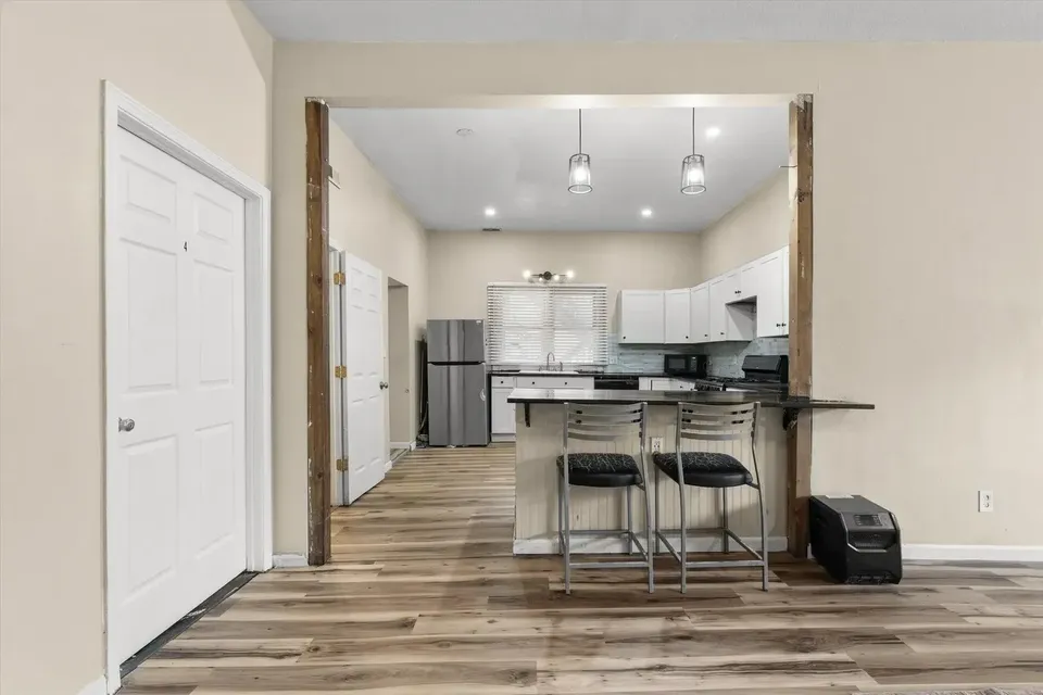 Kitchen bar and shared living area from the 300 Ripley Street Facebook listing